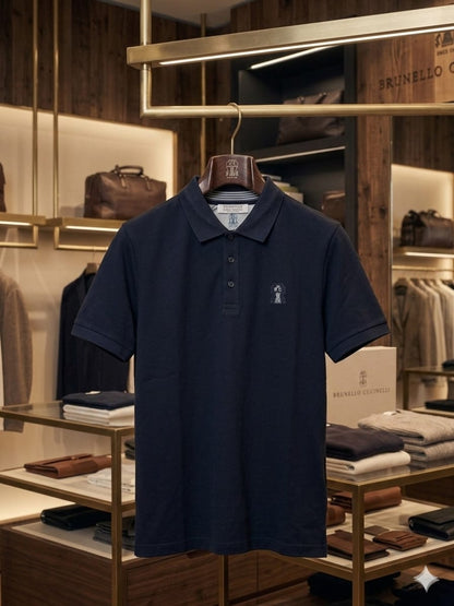 Front view of Brunello Cucinelli navy polo T-shirt with embroidered BC logo

