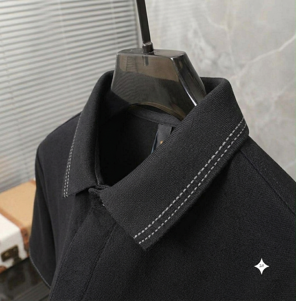 Close-up of black t-shirt fabric and graphic print detail
