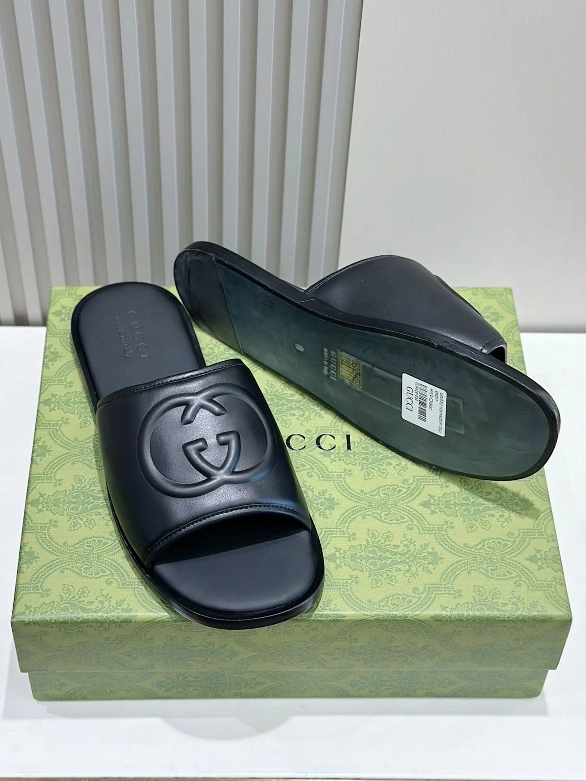 GUCCI || Black Leather GG Embossed Slides – Iconic Luxury Footwear- FASHION MYST