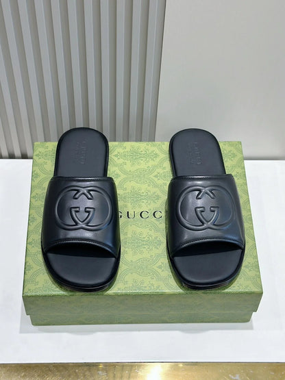 GUCCI || Black Leather GG Embossed Slides – Iconic Luxury Footwear- FASHION MYST