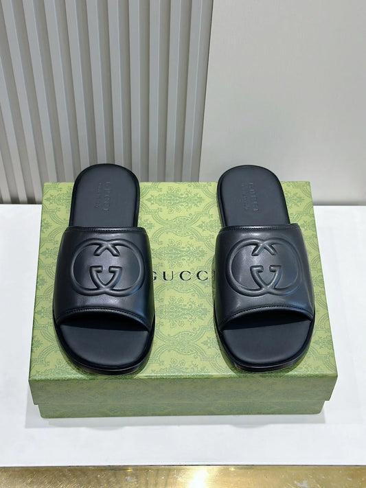 GUCCI || Black Leather GG Embossed Slides – Iconic Luxury Footwear- FASHION MYST