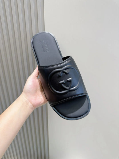 GUCCI || Black Leather GG Embossed Slides – Iconic Luxury Footwear- FASHION MYST