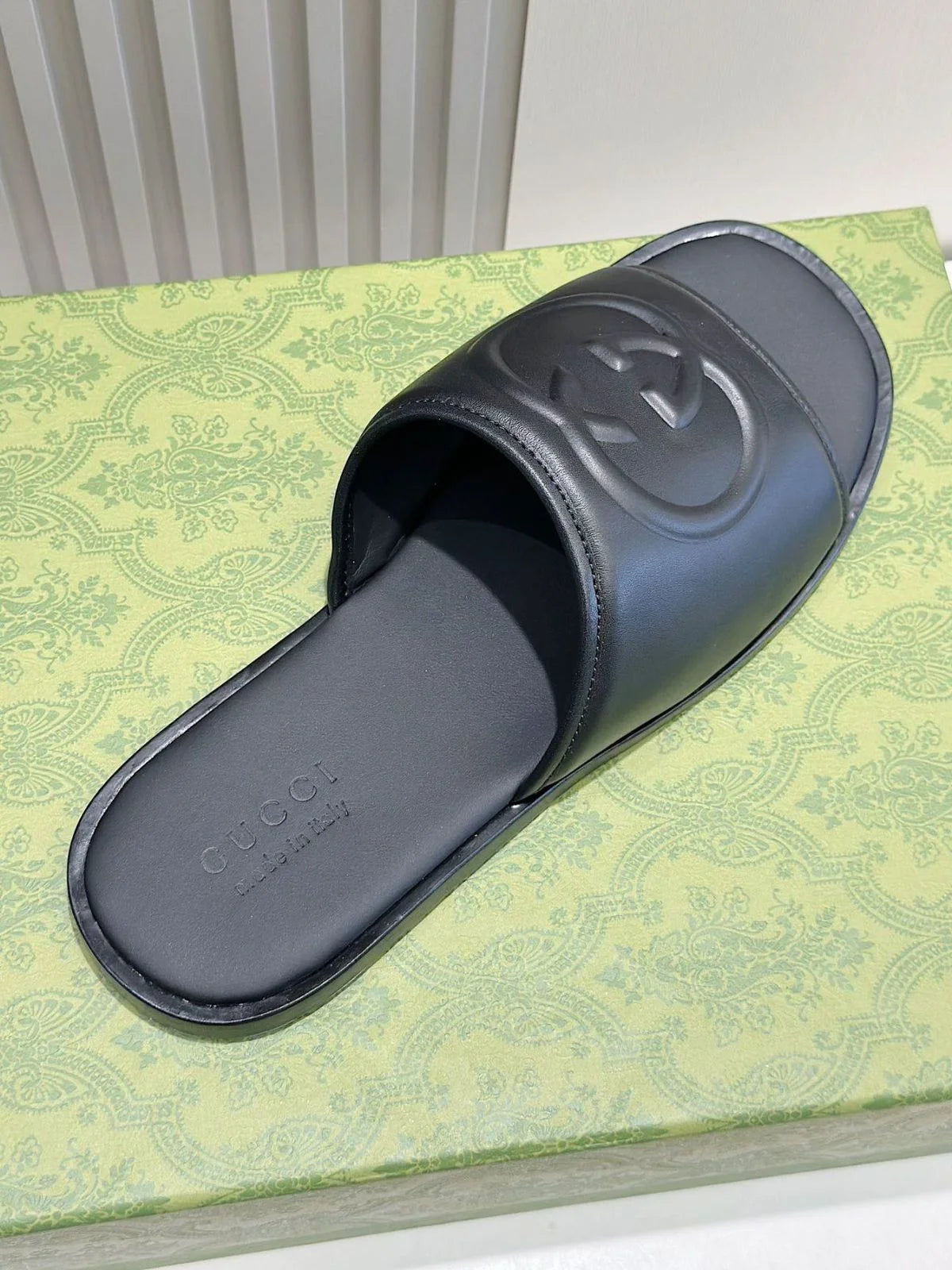 GUCCI || Black Leather GG Embossed Slides – Iconic Luxury Footwear- FASHION MYST