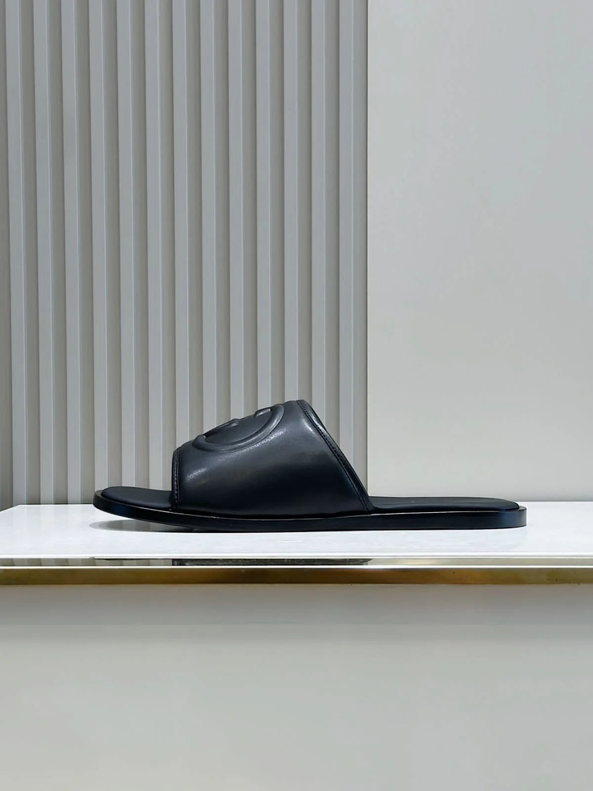 GUCCI || Black Leather GG Embossed Slides – Iconic Luxury Footwear- FASHION MYST
