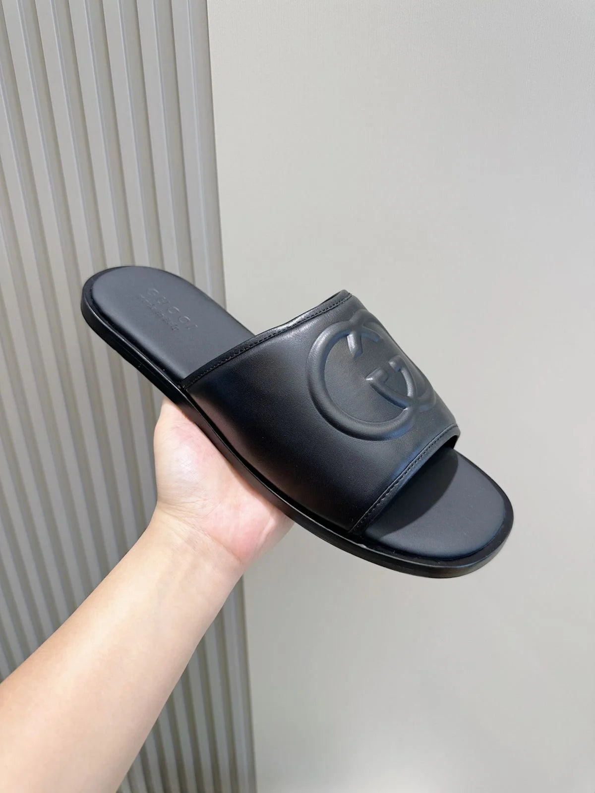 GUCCI || Black Leather GG Embossed Slides – Iconic Luxury Footwear- FASHION MYST