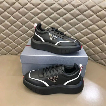PRADA || Black Leather Sneakers with White Piping and Triangle Logo