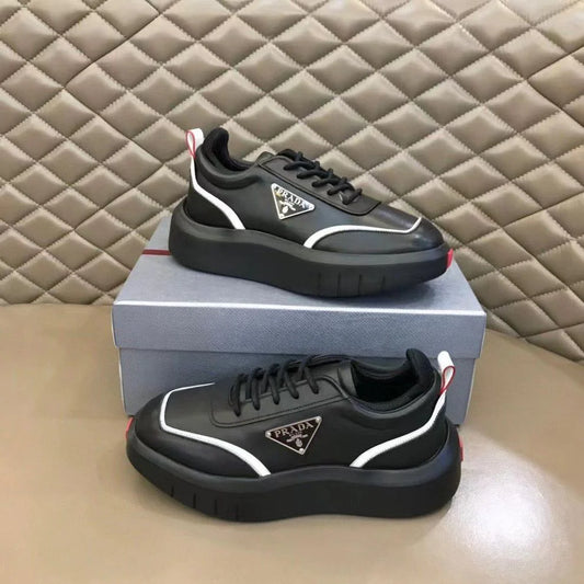 PRADA || Black Leather Sneakers with White Piping and Triangle Logo