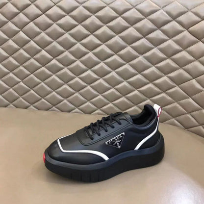 PRADA || Black Leather Sneakers with White Piping and Triangle Logo