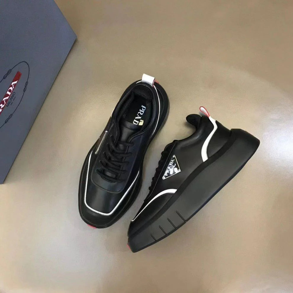 PRADA || Black Leather Sneakers with White Piping and Triangle Logo