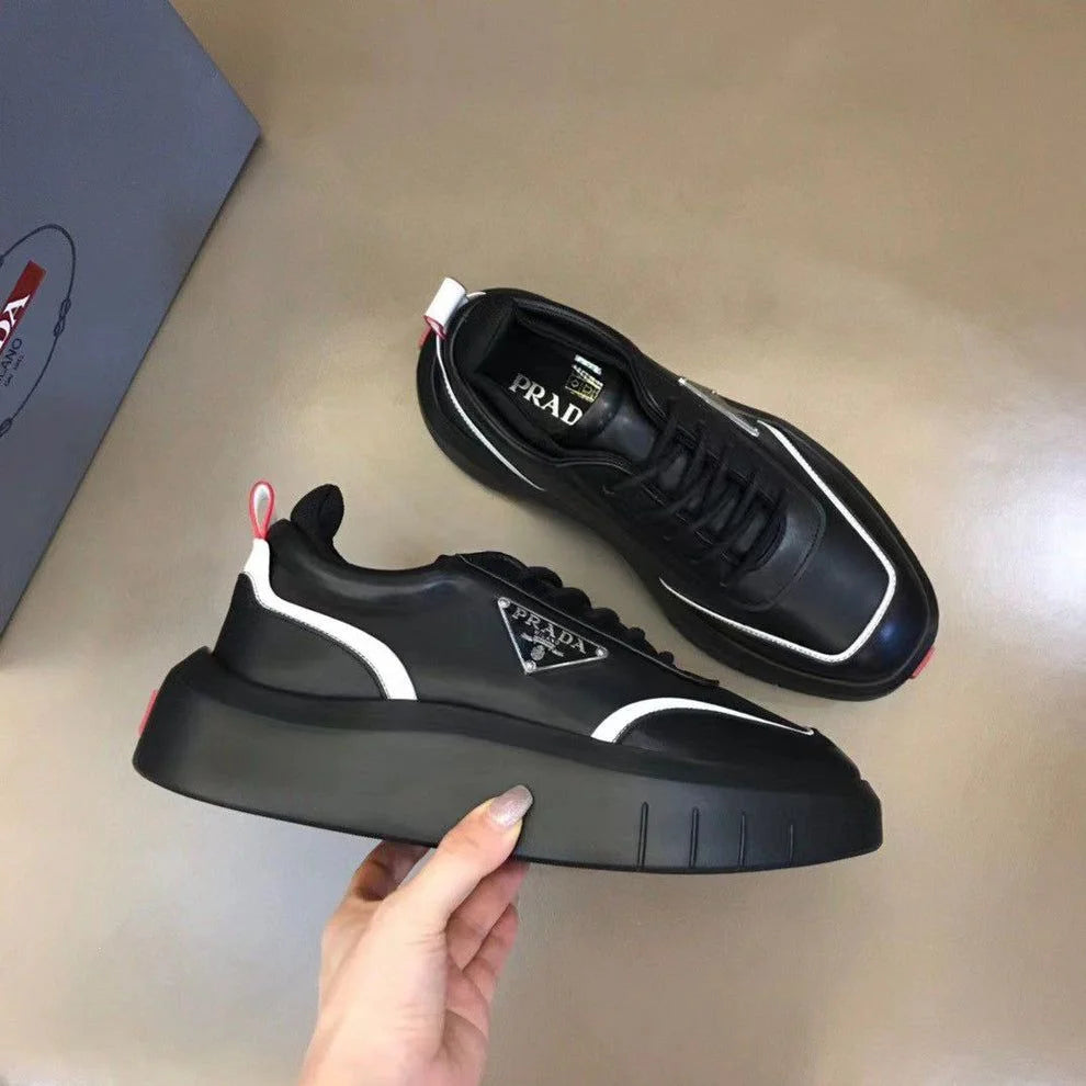 PRADA || Black Leather Sneakers with White Piping and Triangle Logo