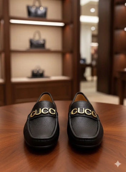 GUCCI || Men's Black Grained Leather Loafers with Gold GUCCI Script Logo - FASHION MYST
