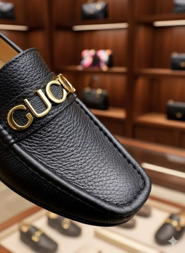 GUCCI || Men's Black Grained Leather Loafers with Gold GUCCI Script Logo - FASHION MYST