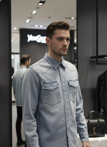 Model wearing Saint Laurent YSL blue denim western shirt with monogram pocket in luxury boutique