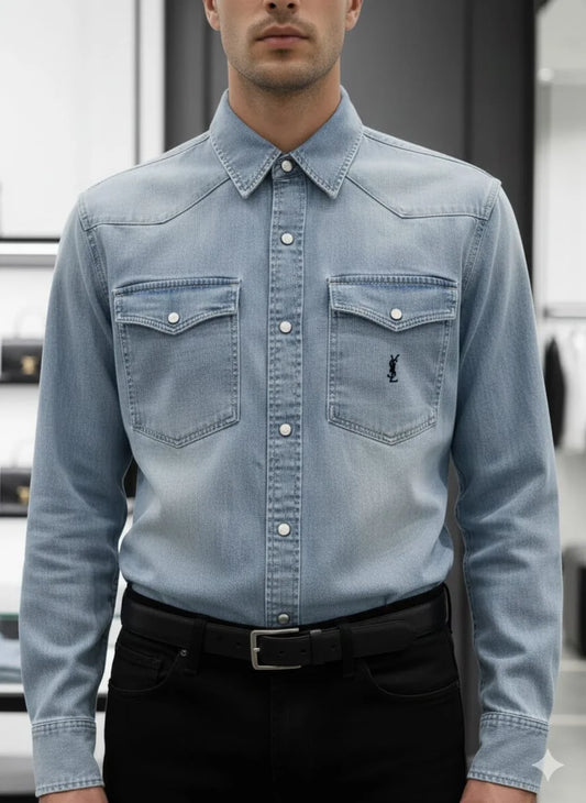 Model wearing Saint Laurent YSL blue denim western shirt with monogram pocket in luxury boutique