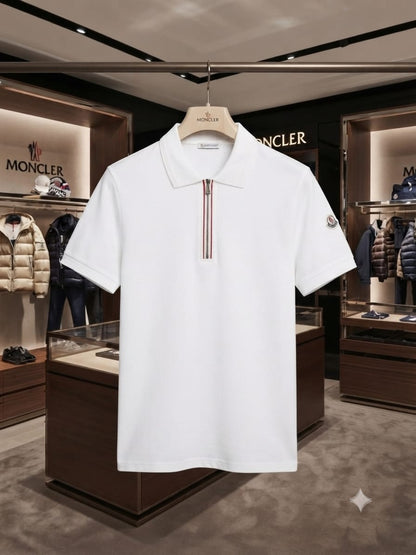 White Moncler half zip polo t-shirt folded on display table
