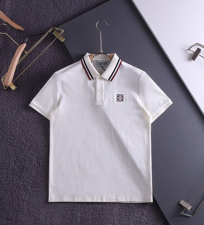 White premium polo shirt with striped collar on hanger, flat view
