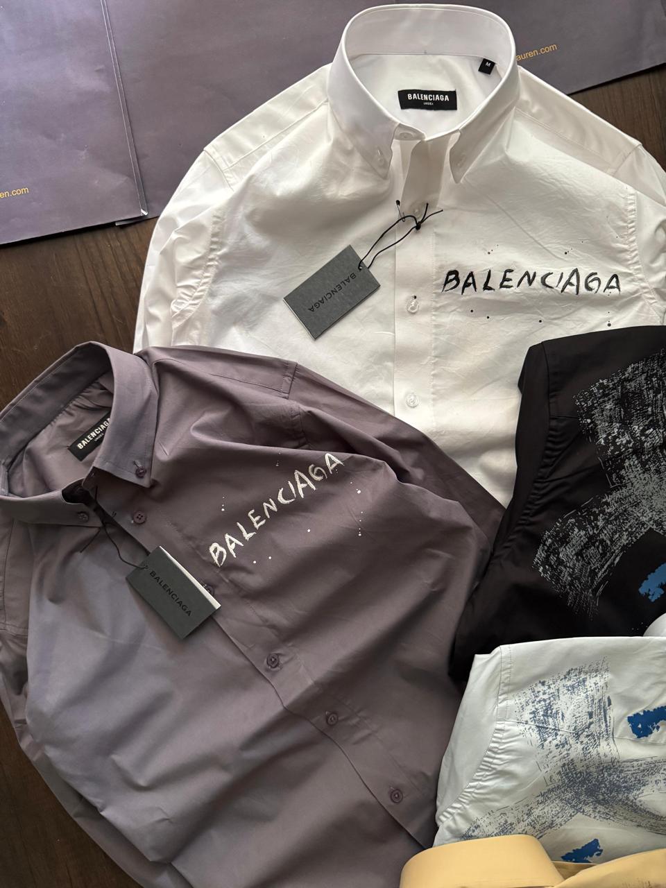 Balenciaga men's luxury designer shirts available in white, black, lilac, yellow, and sky blue