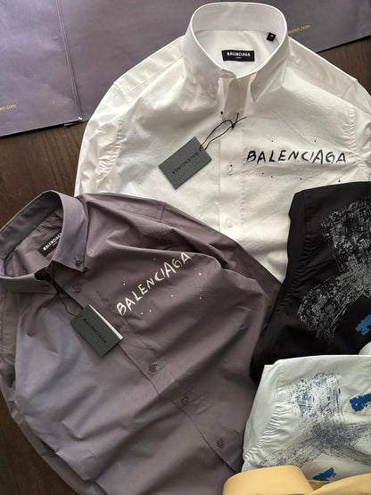 Balenciaga men's luxury designer shirts available in white, black, lilac, yellow, and sky blue