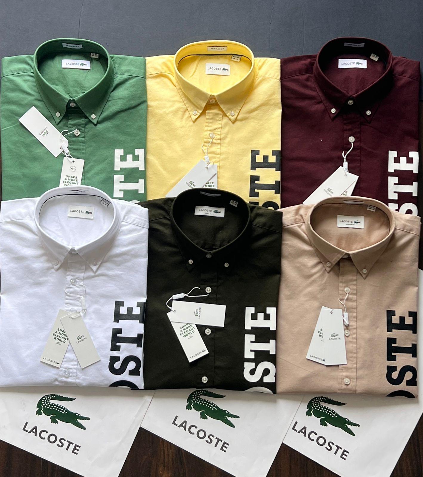 Lacoste premium 100% cotton Oxford regular fit shirts in mint green, yellow, wine, white, black, and Beige. 
