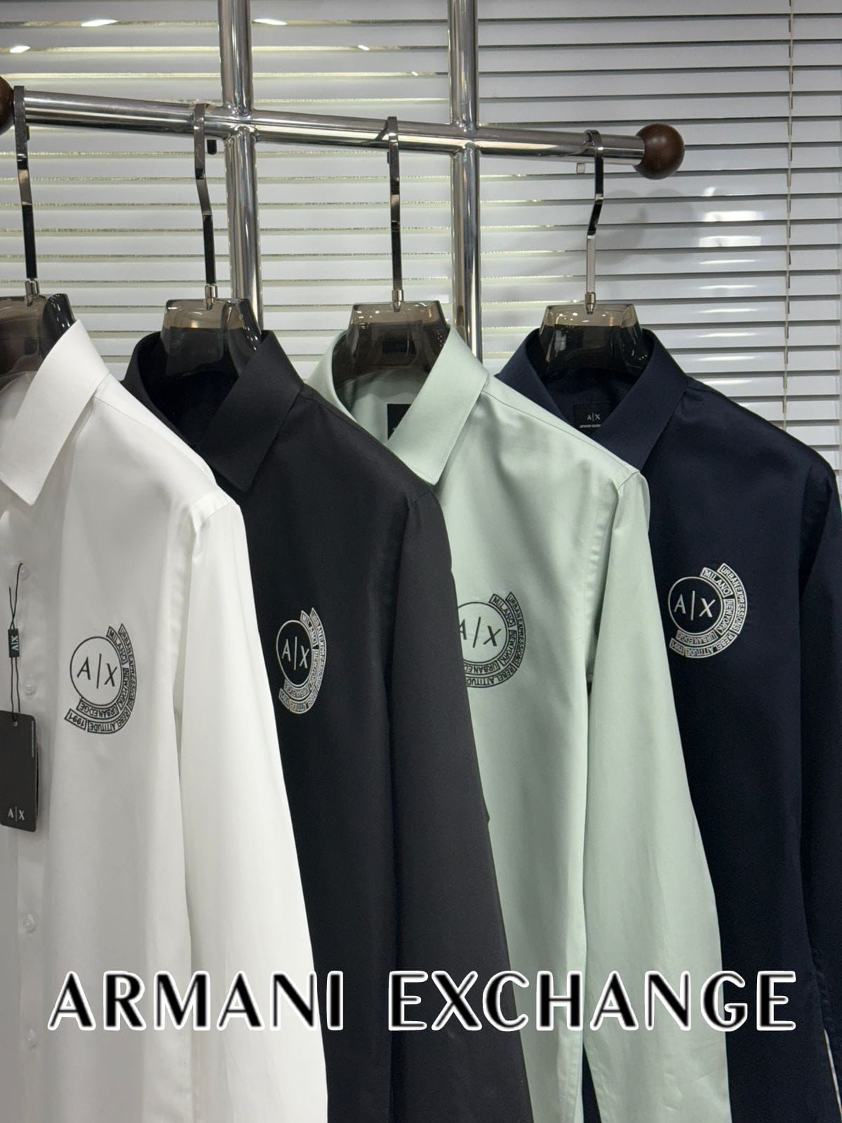 Armani Exchange embroidered logo shirts for men in white, green, navy, and black with branded embossed buttons

