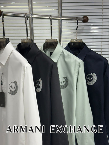 Armani Exchange embroidered logo shirts for men in white, green, navy, and black with branded embossed buttons
