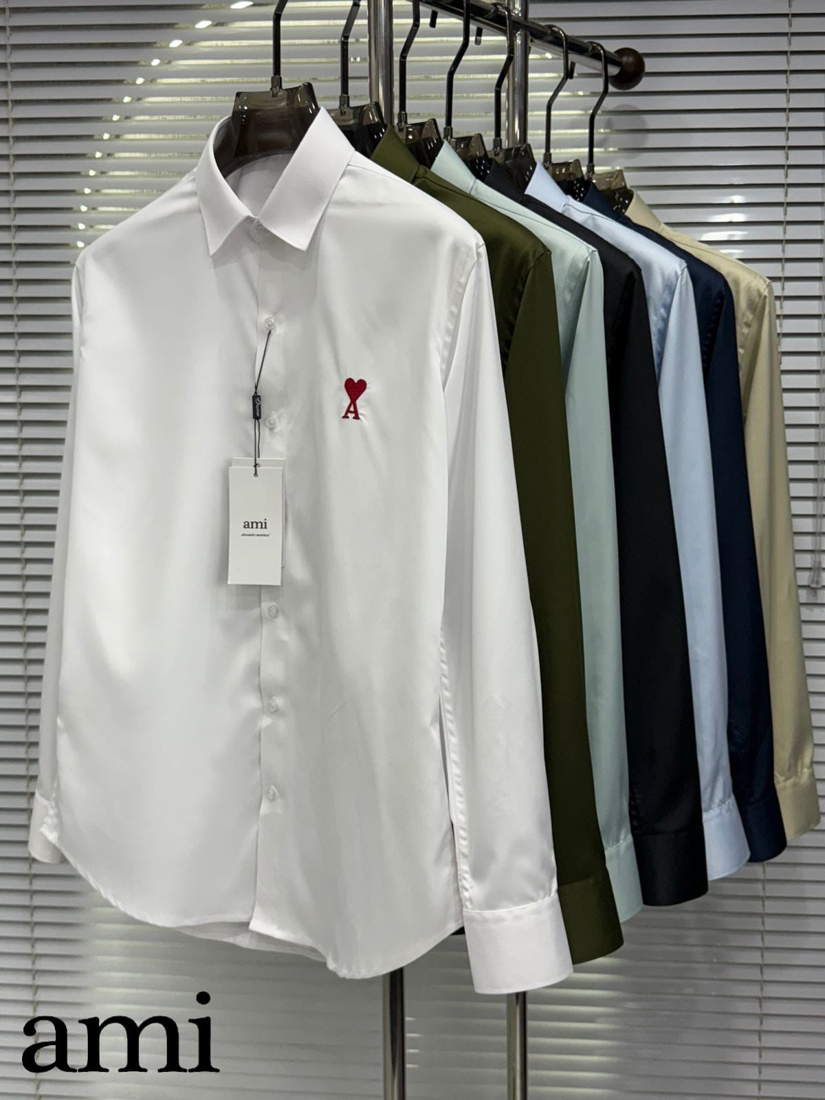 Premium AMI Paris embroidered logo shirts available in green, white, navy, dark green, black, blue, and cream
