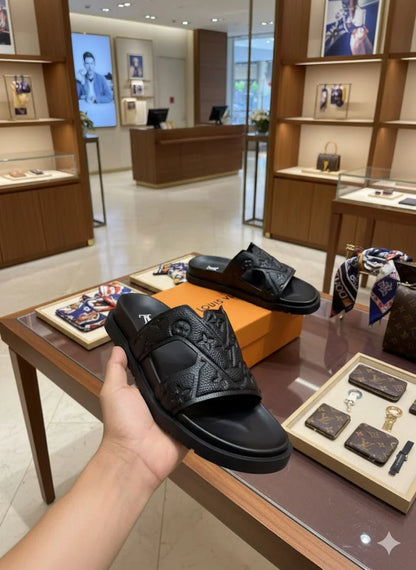 LOUIS VUITTON || Waterfront Mule – Monogram Embossed Black Rubber Sandals