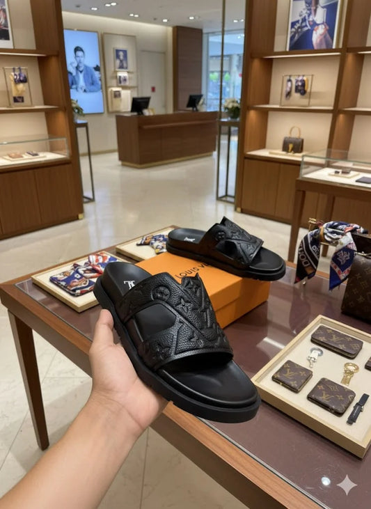 LOUIS VUITTON || Waterfront Mule – Monogram Embossed Black Rubber Sandals